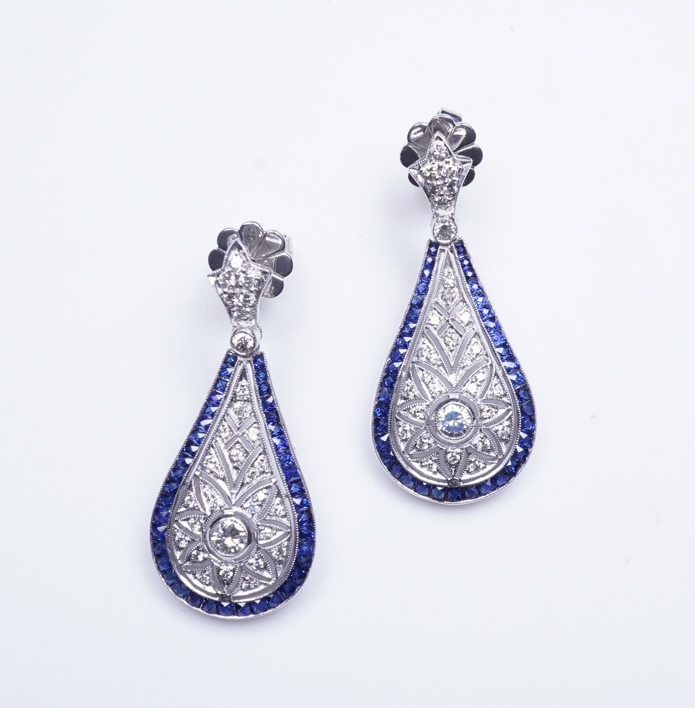 A pair of sapphire and diamond earrings